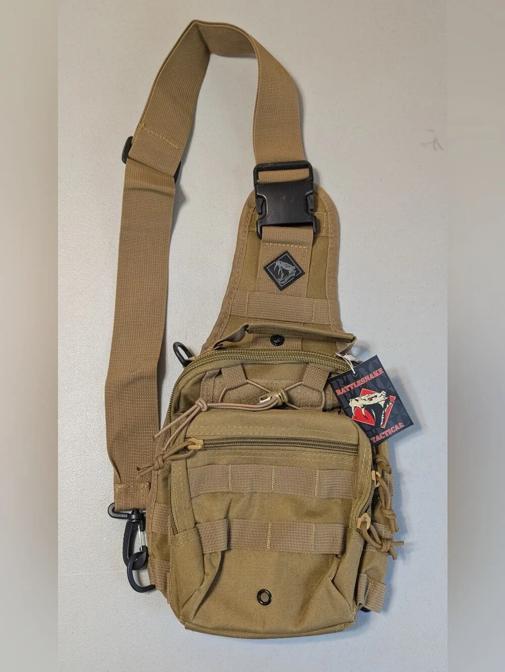 New tan tactical sling pack with holster